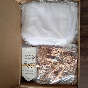 Elegant White Organza Bags with Bronze Key Charms